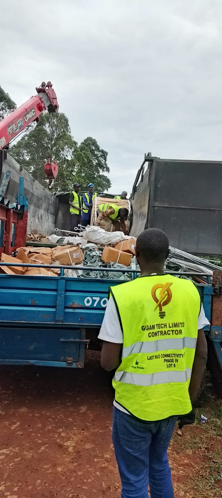 The Gigam Tech crew offloading materials from a truck on site